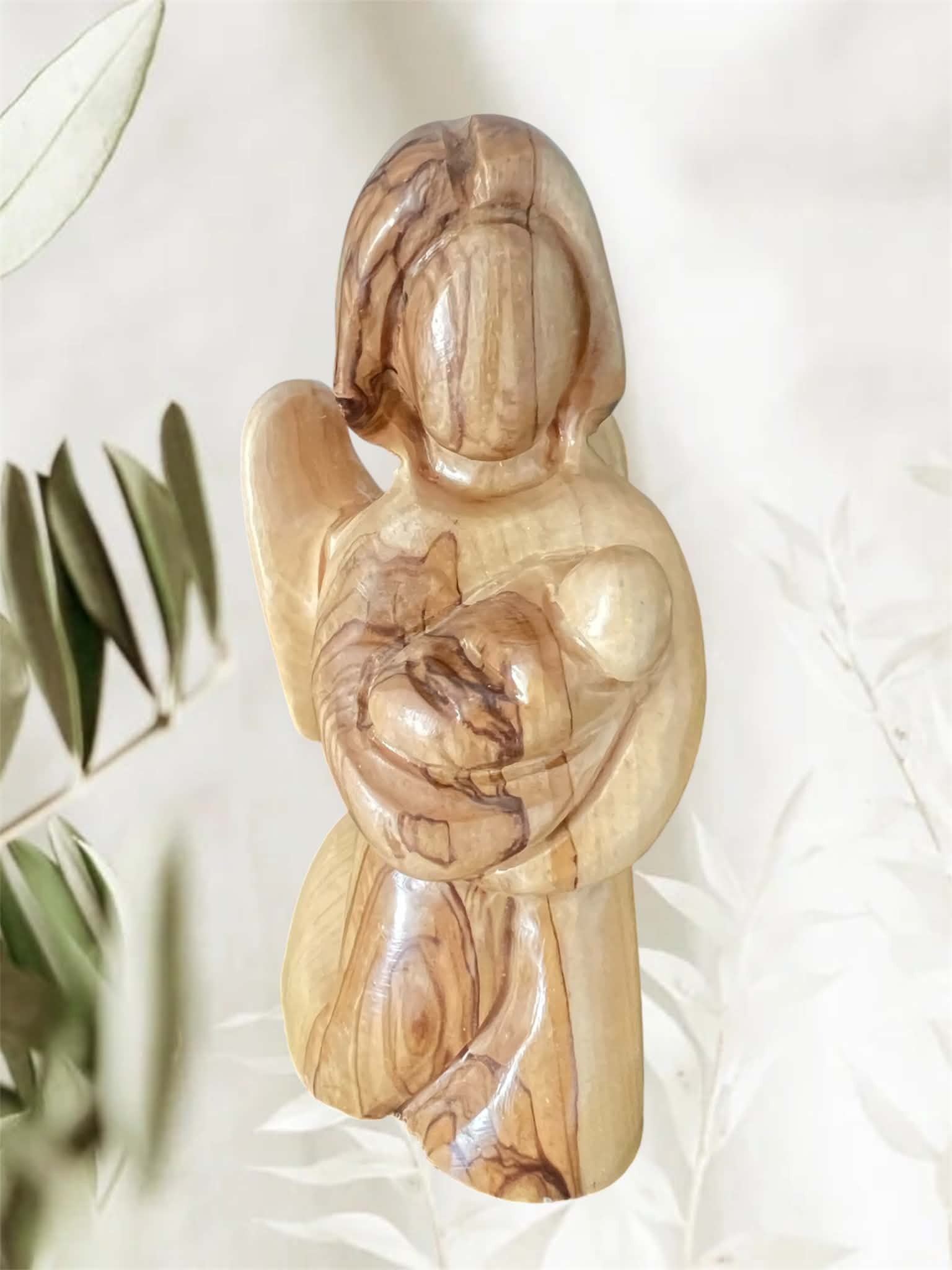Faceless Kneeling Angel Carrying an Angel