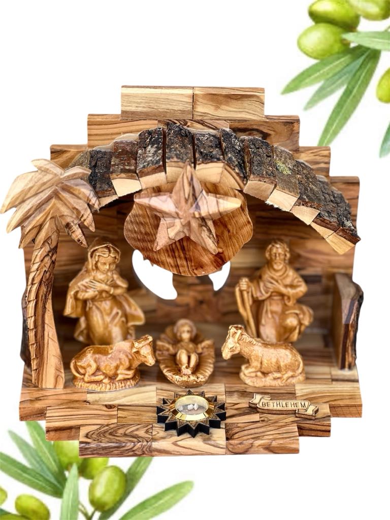 Wooden nativity scene with olive branches.
