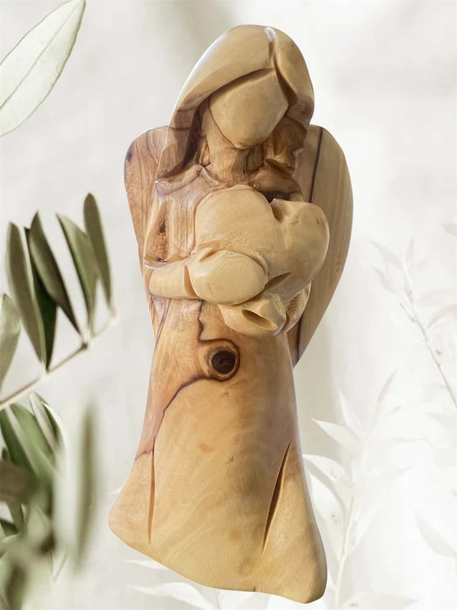 Faceless Standing Angel Holding a Heart